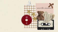 a teddy bear sitting on top of an old fashioned tape recorder next to a record