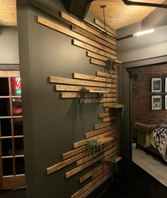 a bed room with a neatly made bed and wooden slats on the wall next to it