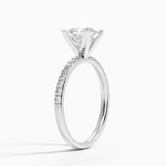 a white gold engagement ring with diamonds on the side