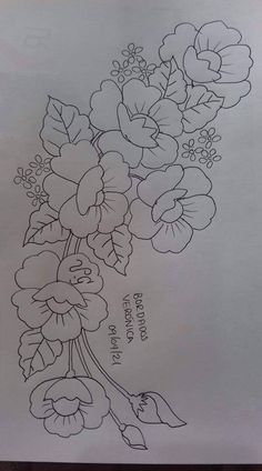 a drawing of flowers on paper with the words, i love you in black ink