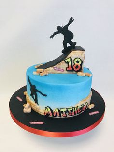 a birthday cake with a skateboarder on top