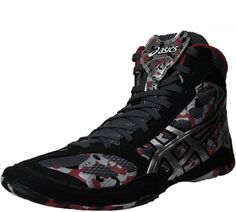 a pair of black and red sneakers with camouflage print on the upper half of the shoe