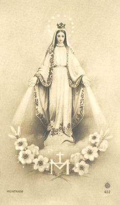 an old black and white photo of a virgin mary with flowers in front of her