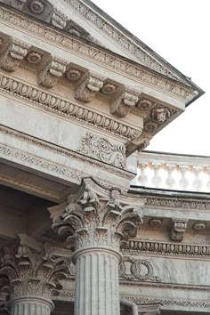 an old building with columns and ornate carvings