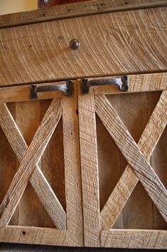 an old wooden cabinet with metal handles