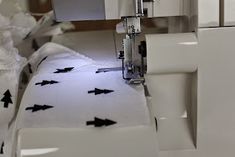 a sewing machine with black arrows on it