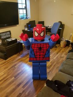 a lego spider man standing in a living room