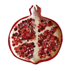 the pomegranate is cut in half to look like it has been sliced into pieces