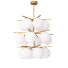 a large chandelier with white glass balls hanging from it's brass frame