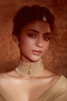 Gold toned choker in grading pattern layers, strewn with pearls, with links and a TT drop at the back.

Type: Pearls
Color: Ivory
Other Details: 
Multi layers
TT charm at back
Note: Maangtikka and earrings worn by the model is not for sale - Aza Fashions Contemporary Bridal Jewellery, Choker Necklace Online, Choker Jewellery, Indian Choker Necklace, Indian Wedding Jewelry Sets, Necklaces Choker, Fancy Jewelry Necklace, Jewellery Necklaces, Pearl Necklace Designs