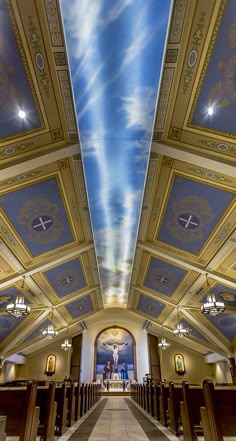 the interior of a church with painted ceilings