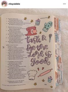 an open book with doodles on the pages and writing in cursive letters