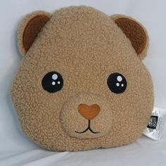 a brown teddy bear with big eyes on a white background