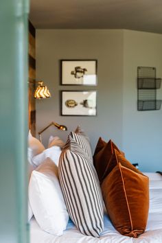 two pillows on top of a bed in a bedroom