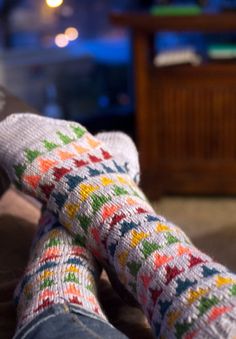 Socks so cute you’ll want to eat them up. These mid-calf socks have an afterthought heel, which makes it easy to keep the pattern going. The main colour for these socks is the scrumptious Snowfall, a Sweet Georgia Tough Love Sock yarn, and bits of similarly weighted bright colours from my stash of old sock yarns.**YARN**- MC: Sweet Georgia’s Tough Love Sock in Snowfall, 1 skein (425 yds).- CCs: Less than a ball of sock weight yarn in each pink, yellow, green, blue, and red (about 50 yds of each Avocado Socks, Knitted Accessories, Socks Knitting, Diy Socks, Hand Knit Socks, Socks Pattern, Sock Knitting Patterns, Knitted Socks, Tough Love