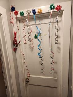 the door is decorated with streamers and ribbons for holiday decorations, including star - shaped confetti