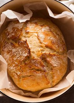 a loaf of bread sitting inside of a pot