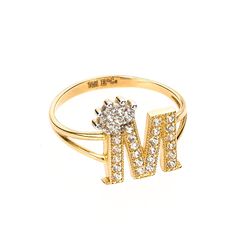 👑 PRODUCT DETAILS Unleash majestic elegance with our exquisite Crown Initial Letter "M" Ring, meticulously crafted from 100% Real Gold 14K and adorned with a sparkling CZ accent. This ring effortlessly marries personalization with regal sophistication. 💍 A Majestic Statement Available in ring sizes from 5 to 9, our Crown Initial Letter "M" Ring makes a statement of both style and significance. With an approximate weight of 2.5 grams, it offers a substantial yet graceful piece to grace your fin M Letter Ring For Women, Diamond Promise Ring With Initials, Anniversary Cubic Zirconia Rings With Initials, Yellow Gold Cluster Ring With 17 Jewels, Wedding Diamond Ring With Initials, Elegant Cubic Zirconia Jewelry With Initials, Luxury White Gold Initial Ring With Diamond Accents, Luxury Hallmarked Cubic Zirconia Diamond Ring, Promise Diamond Ring With Initials