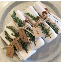 napkins wrapped in twine and tied with twine are sitting on a plate