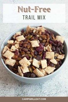 a bowl filled with trail mix on top of a white counter next to the words nut - free trail mix