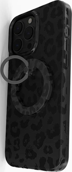 an iphone case with a ring attached to the back of it, on a white wall