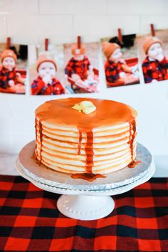 there is a cake on the table with orange icing