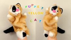 two stuffed animals that look like they are holding each other's hands with the words puppett yellow cat on them