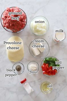 ingredients to make ground beef recipe laid out on a marble counter top with text describing the ingredients