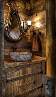 the bathroom is decorated in rustic wood