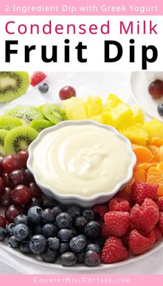 a white plate topped with fruit and dip