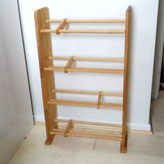 a wooden rack that is next to a wall