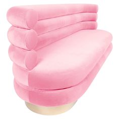 a pink couch sitting on top of a white mannequin's head in front of a white background