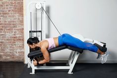 a woman is doing exercises on a bench