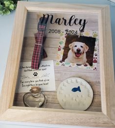 a wooden frame with a dog's photo and personalized items