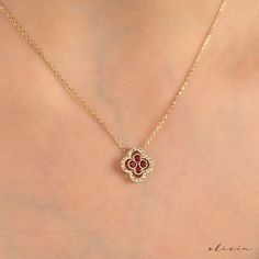 "Enhance your grace with our Clover Gold Pendant Necklace, featuring a brilliant rubies, July's birthstone, and delicate diamonds. This 14K gold necklace exudes charm, ideal for women seeking a touch of sophistication. Celebrate love and luck with our clover-themed charm necklace, a perfect blend of fine gold and precious gemstones. F E A T U R E S 💎 D I A M O N D Carat: 0.15 Quality: VS1 Color: F-G Cut: Round 💠 G E M S T O N E Gem: Ruby Carat: 0.30 Total Cut: Round 🌟 M A T E R I A L Gold: Available in 14K and 18K Options Color: Choices of White, Rose, or Yellow Chain: Cable Closure: Spring Ring 📏 S I Z E Motif Size: W: 11.75mm H: 11.75mm 🎁 Extra Touch: As a testament to our dedication to exceptional customer service, each purchase is accompanied by a complimentary product certificate Elegant Gold Necklace With Ruby, Celebration Yellow Gold Ruby Necklace, Elegant Ruby Necklace With Heart Charm, Yellow Gold Ruby Birthstone Pendant Necklace, Yellow Gold Ruby Pendant Jewelry, Ruby Diamond Necklace, Fine Gold Necklace, Lucky Charm Necklace, Clover Charm