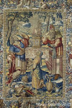 a tapestry with an image of people and animals