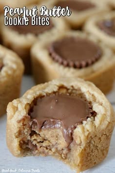 peanut butter cookie bites are cut in half and stacked on top of each other with chocolate inside