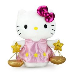 a hello kitty doll holding two gold stars and a scale with one star on it