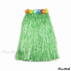 a green grass skirt with flowers on the top and bottom, in front of a white background