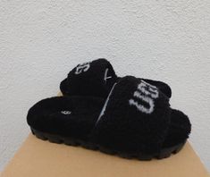 UGG COZETTA CURLY GRAPHIC SHEEPSKIN STREET FRIENDLY HOUSE SLIPPERS  WOMEN'S US SIZE 9/ EUR 40/ UK 7 ~ NEW IN BOX COLOR: BLACK STYLE # 1132891 ~ MY ITEMS ARE ALWAYS AUTHENTIC, UGG AUTHENTICITY LABEL ON THE LEFT SLIPPER For both indoor and outdoor use Curly sheepskin uppers with UGG logo on the vamp Genuine curly sheepskin sock liner that naturally wicks away moisture and helps keep your feet dry, warm and cozy Lined with UGG plush wool Street friendly Sugarsole ( made from sugarcane) Inside size tag and box upc have been marked to prevent retail store returns Please note, most UGGs are now made in China, Vietnam, Philippines or Cambodia. None are made in Australia.. IF IN DOUBT, CONTACT UGG I BUY ALL MY UGG'S FROM THE UGG PARENT COMPANY ( DECKERS). YES, DECKERS OWN'S UGG! I HAVE SOLD OVER 2 House Slippers Womens, Liner Socks, Cute Lazy Day Outfits, Lazy Day Outfits, House Slippers, The Vamps, Ugg Australia, Womens Slippers, Shoe Game