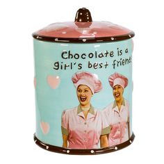 Store your cookies in retro-inspired style with this I Love Lucy Cookie Jar from Kurt Adler! Perfect for fans of I Love Lucy, this cookie jar is inspired by the chocolate factory episode and features Lucy and Ethel wearing their pink chocolate factory uniforms. The cookie jar reads, "Chocolate is a girl's best friend!". Kurt Adler | Kurt Adler I Love Lucy Cookie Jar 9.63 H x 6.25 W x 6.25 D in / redCeramic in Blue / Pink | 6.25" L x 6.25" W x 9.63" H | Wayfair | Organization Lucy And Ethel, Ceramic Cookie Jar, Pink Chocolate, Lucille Ball, Kurt Adler, Love Lucy, I Love Lucy, Chocolate Factory, Winter Pictures