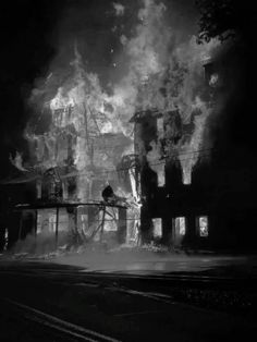 black and white photograph of fire in an old building