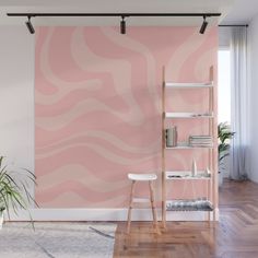 a living room with pink and orange wallpaper