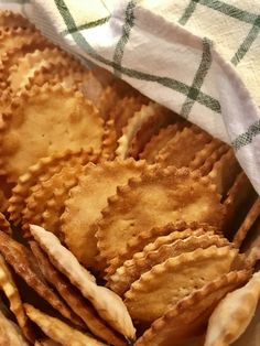 some crackers are in a basket on a table