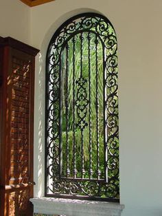 an iron gate in the corner of a room