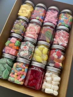 a box filled with lots of different types of candy in it's lids and containers