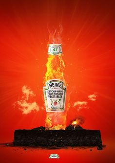 a bottle of heinz's vegetable oil on fire with the sky in the background