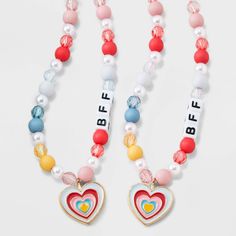 The Girls' 2pk Heart Charms BFF Necklace Set from Cat & Jack™ includes two charming necklaces with heart-shaped pendants, perfect for sharing with your best friend. With an overall length of 16 inches and a lobster claw clasp closure, these necklaces are easy to wear and secure. Made with quality zinc alloy, polyester and acrylic, these necklaces are not only stylish but also durable. Get these adorable "BFF" beads and show off your friendship in style. Cat & Jack™: Kids’ clothing with an imagin Trendy Friendship Necklace For Valentine's Day, Trendy Heart-shaped Necklace For Friendship, Pink Heart Charm Necklace For Friendship, Adjustable Cute Charm Necklaces For Friendship, Cute Adjustable Charm Necklace For Friendship, Cute Adjustable Charm Necklaces For Friendship, Multicolor Heart Necklaces For Friendship, Multicolor Heart Necklace For Friendship, Adjustable Charm Necklaces With Heart Pendant For Friendship