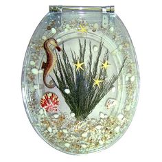 a toilet with seahorses and starfish in it