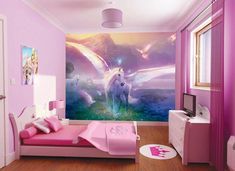 a bedroom with pink walls and a unicorn mural on the wall